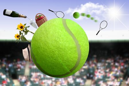 Tennis ball with net and game, and crowds in the backgroundの写真素材