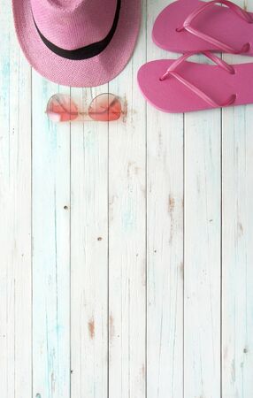 Summer accessories including flip flops, hat and sunglassesの写真素材