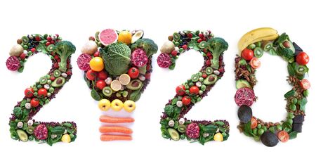 2020 made of fruits and vegetables including a light bulb iconの写真素材