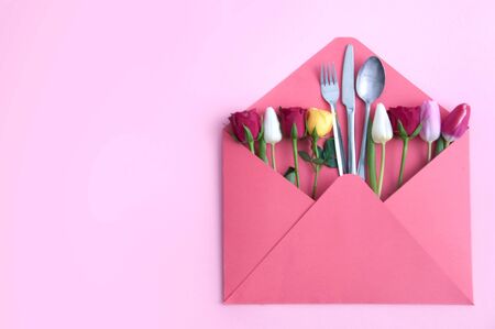 Cutlery inside an envelope with assorted flowers
