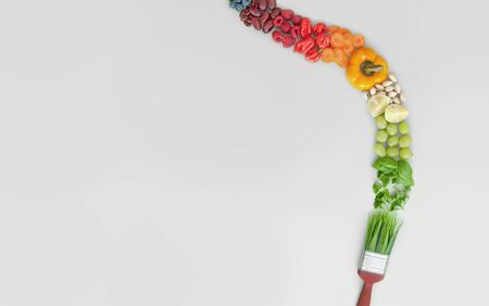 Balanced vegan diet, brush stroke concept, colourful food groups, including fruits, vegetables, nuts and grainsの写真素材