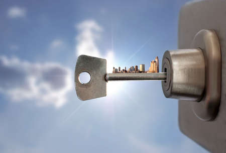 Key with city skyline inside a door lockの写真素材
