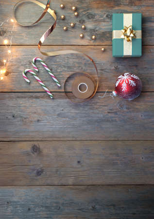 Christmas accessories including gift box, baubles and candy with spac for textの写真素材