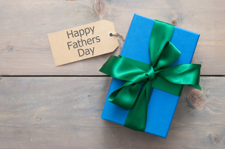 Fathers day gift box wrapped with silk ribbon with greetingの写真素材