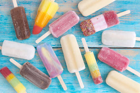 Assortment of many frozen ice lolliesの写真素材