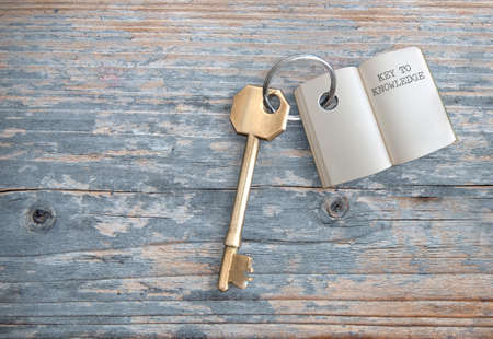 Keyring with open book key to knowledgeの写真素材