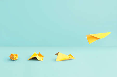 Different stages of making a paper airplane, creating something from nothing success conceptの写真素材