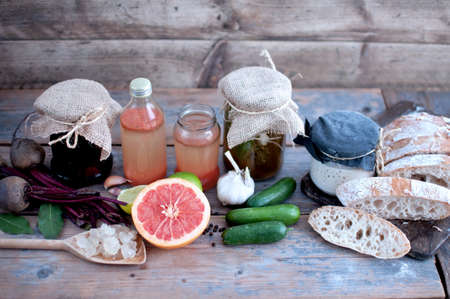 Traditionally fermented produce, including cucumbers and beetroot, sourdough starter, with bread and water kefir with grainsの写真素材
