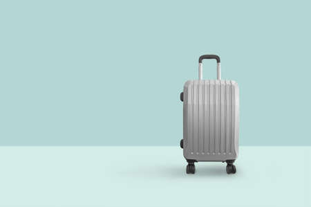 Suitcase isolated on green backgroundの写真素材