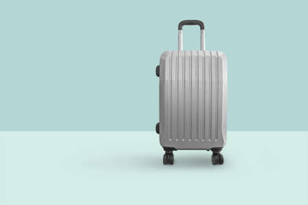 Cabin bag suitcase isolated on green backgroundの写真素材
