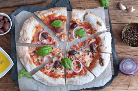 Traditional italian sourdough pizza with tomato and mozzarellaの写真素材