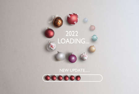Baubles in the shape of a page loading icon with 2022 in the centre and new updateの写真素材