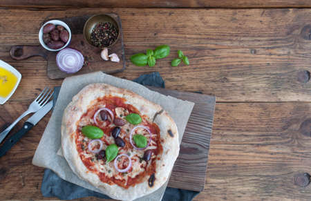 Traditional italian pizza with mozarella and tomatoの写真素材