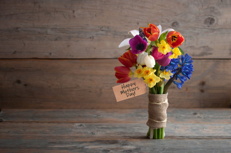 Happy mothers day bouquet of flowers including lilies; daffodils and hyacinthの写真素材