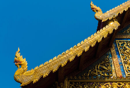 Thai Temple Roof with Nagas Decoration の写真素材