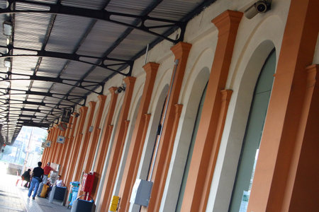 A long perspective looking down a colorful train stationの写真素材
