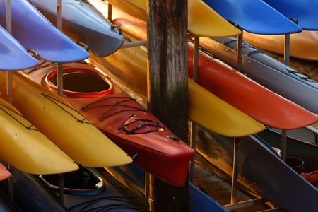 A rack full of kayaks waiting to be usedの写真素材