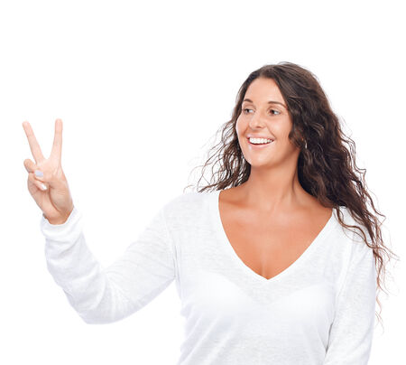Closeup portrait of a girl showing fingers isolated on white backgroundの写真素材