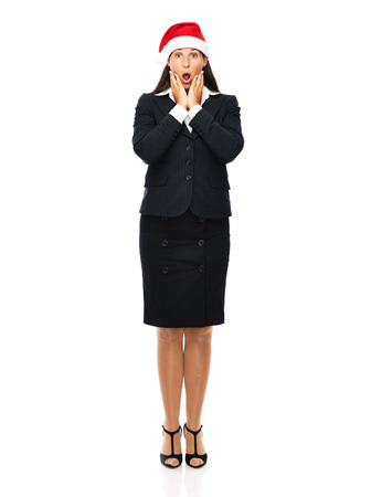 Business woman with santa hat is surprised.   Isolated on a white background.

の写真素材