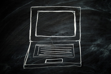 Hand drawn laptop with chalk on blackboardの写真素材