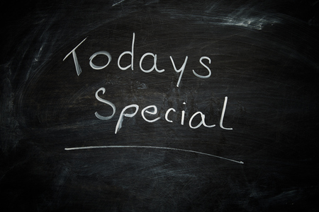Todays special hand drawn on a blackboard with white chalkの写真素材
