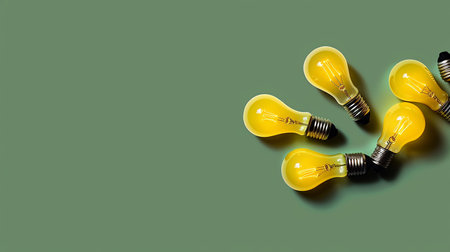 Group of light bulbs on green background with copy space. Idea concept.の素材