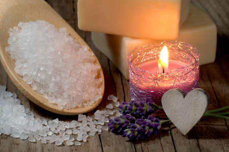 Natural spa setting with bath salt and candleの写真素材