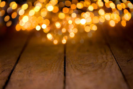 Bokeh background with empty wooden boards and copy spaceの写真素材