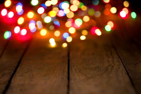 Bokeh background with colorful lights on wooden boards