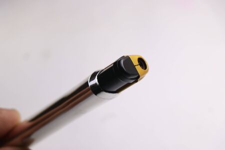 Cigarette lighter which is used to light cigarettes on white backgroundの写真素材