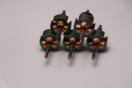 Toy dc motor rotor on white backgroundの写真素材