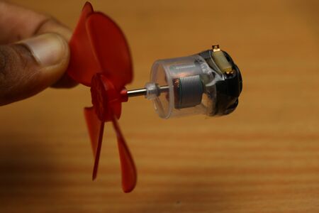 DC Motor used in remote controlled toys modified to transparent version and made a mini fanの写真素材