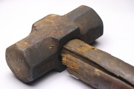vintage hammer which has a crack on its wooden handle body