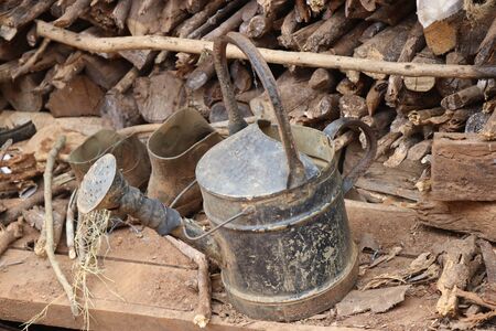 Vintage water pot which is old and rusty unused for long periods of timeの写真素材