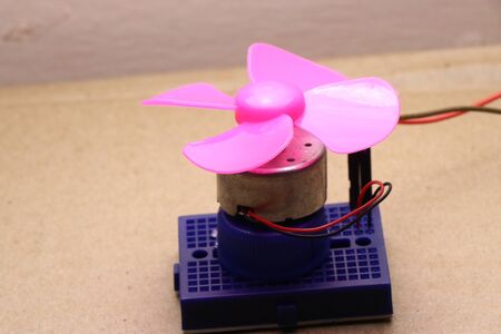Simple electronic circuit showing dc motor connected to breadboardの写真素材