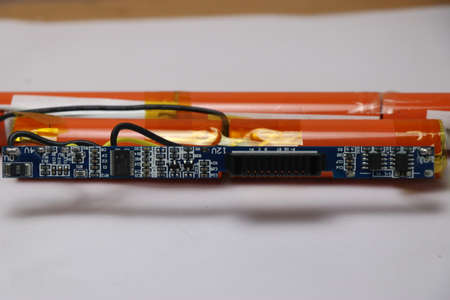 Disassembled view of laptop battery with electronic circuit boardの写真素材