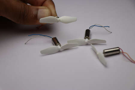 coreless motor set with propellers attached to its shaft used in making drones held in handの写真素材
