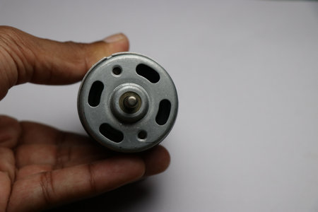Front view of High speed DC Motor also called as 775 motor which has large torque and low noise. 12v DC Motor held in handの写真素材