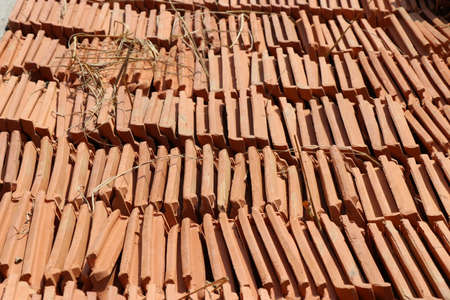 Group of roofing tiles arranged to form awesome background. Clay roofing tiles textureの写真素材
