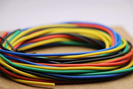 Colorful wire roll used in making electrical circuit connection between devices. Colorful electrical...