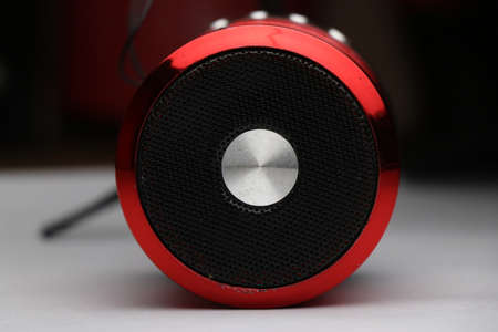 Portable speaker with close-up of speaker grills. Audio speaker used to amplify sounds from laptop and smart phonesの写真素材
