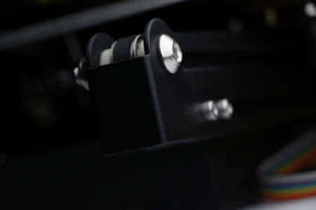 Close up of 3D printer heating bed movement supporting frame. Three dimensional printer parts