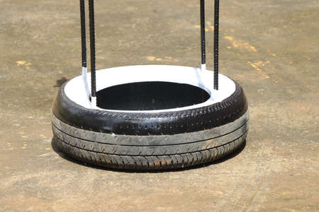 Old tire from a car attached with iron rods to make something useful, Waste rubber tire reuse...