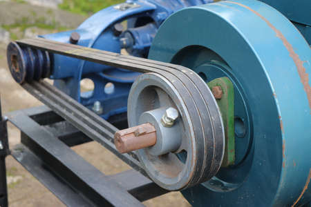 Belt drive of Diesel engine water pump, Pulley and belt transmission view from the centrifugal water pumpの写真素材