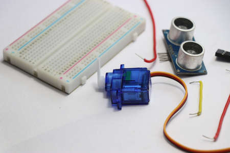 Breadboard with micro servo and ultrasonic sensor module for development board projects