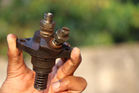 Fuel injector that supplies fuel to the combustion chamber of internal combustion diesel-powered engines held in handの写真素材
