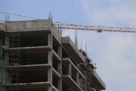 Construction of the new building with Cranes on the constructing site. Crane and building...