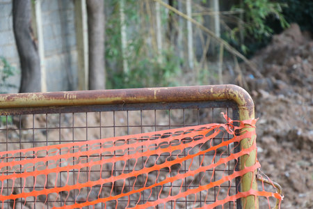 Construction barriers or Roadblock barriers are made of metal with a side part view and some plastic ribbons tieの写真素材