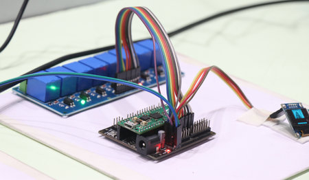 Relay module with optocoupler connected to a programmable microcontroller board to work on some...