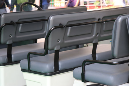 Electric Shuttle Passenger Bus with a view of its seats. Seat of an Golf Car or resort carの写真素材